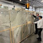 fabricator measuring slab of granite