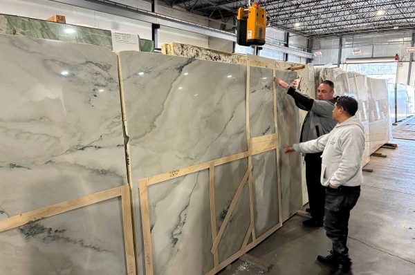 fabricator measuring slab of granite
